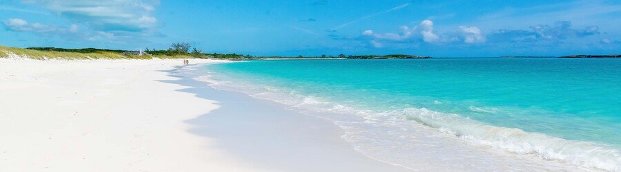 Shallow turquoise water and bright white sand at the Tropic of Cancer Beach on Little Exuma.
