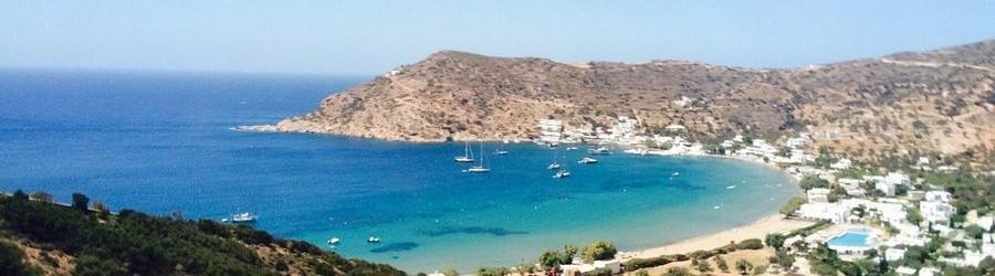 Vathi Beach Sifnos with golden sand, shallow water, and peaceful bay.