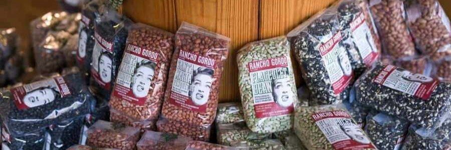 Alt Text:
Heirloom beans at Alta Baja Market in Todos Santos Mexico displayed in labeled bags showcasing local Baja ingredients