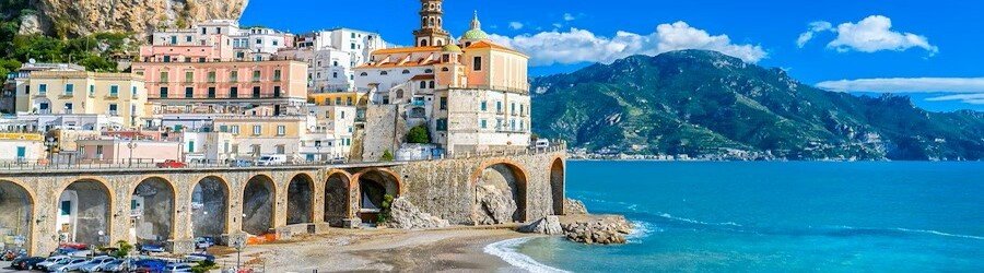 Historic Amalfi Coast town with arches and sea views near Naples