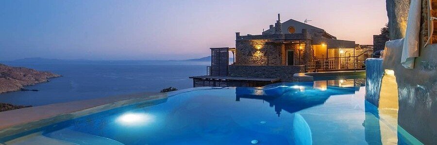 Infinity pool and sea-view terrace at Aneroussa Beach Hotel on Andros Island, Greece.