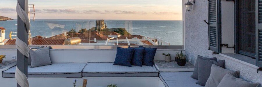 Private terrace with sea views at Camara Suites in Chora, Andros, Greece.