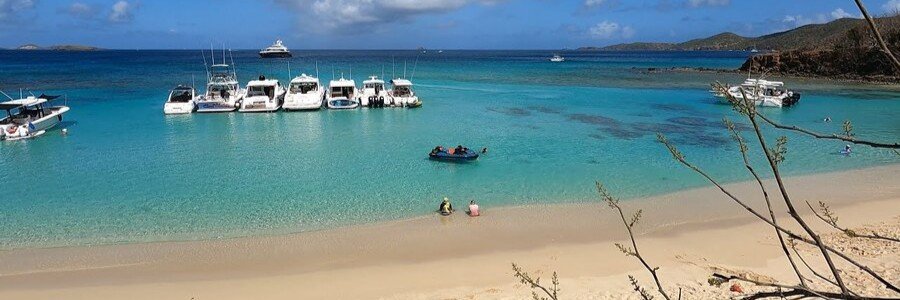 Turquoise water and anchored boats along the shoreline of Cayo Luis Peña near Culebra, Puerto Rico