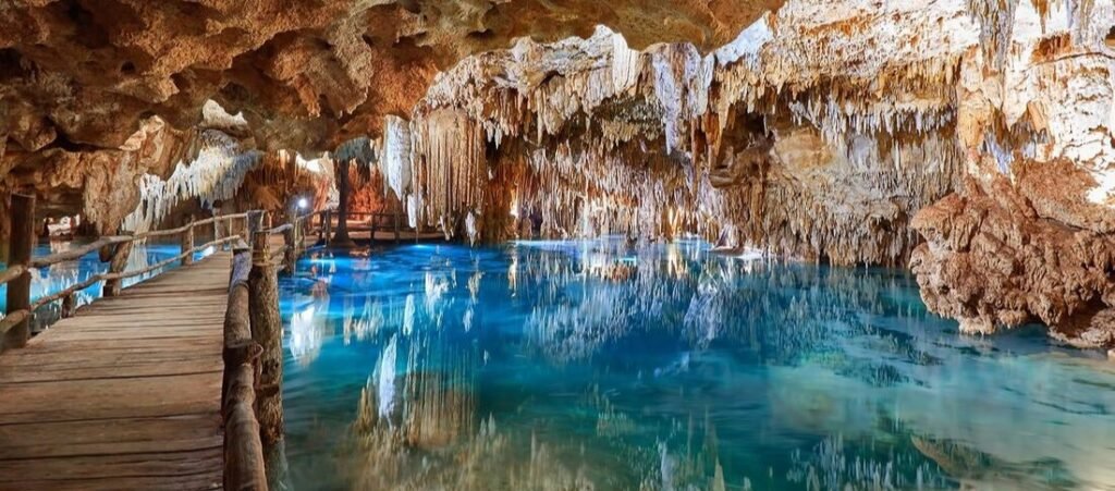 Crystal-clear blue water inside Cenote Choo-Ha in the Yucatán Peninsula, Mexico.