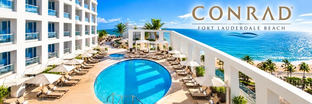 Luxury hotel with a sparkling turquoise swimming pool, white umbrellas, elegant balconies, and beautiful Atlantic Ocean views.