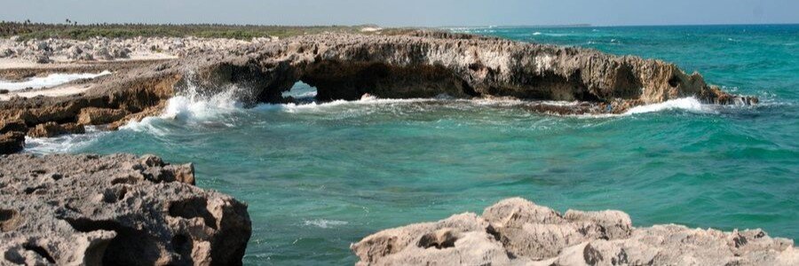 Rocky Coastline in Cozumel | Beach Travel Destinations Rocky coastline and turquoise Caribbean Sea at Cozumel, Mexico.