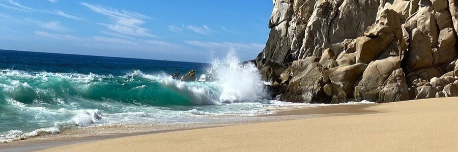 Cabo Beaches at Divorce Beach with powerful waves crashing beside rugged cliffs
