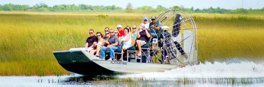 Airboat carrying visitors across the Everglades wetlands in South Florida.