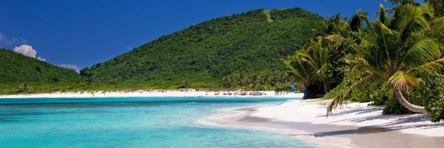 White sand and turquoise water at Flamenco Beach paradise.