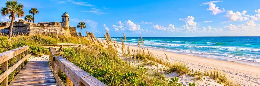 Florida Atlantic Coast: First Coast Florida Atlantic Coast First Coast with a historic coastal fort, sandy beach, turquoise ocean, dunes, and sea oats.