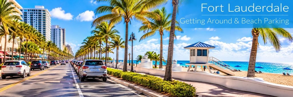 Fort Lauderdale beach parking along a palm-lined boulevard with parked cars, beachfront hotels, a lifeguard tower, and turquoise Atlantic waters.