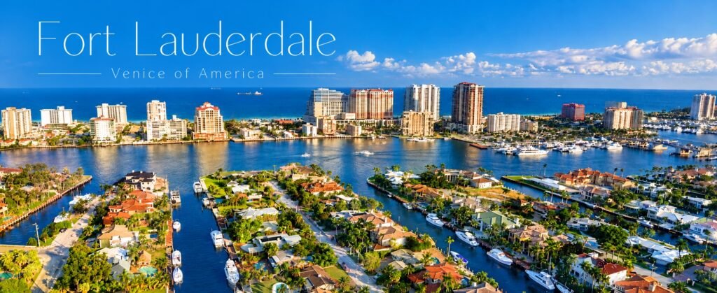 Aerial view of Fort Lauderdale featuring scenic canals, luxury waterfront homes, yachts, palm trees, and the Atlantic Ocean.