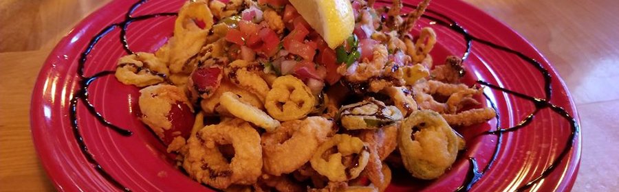 Fried calamari appetizer served on red plate at restaurant in Big Pine Key Florida