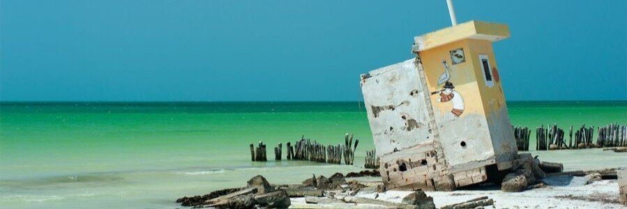 Abandoned Lifeguard Tower on Holbox | Beach Travel Destinations Abandoned lifeguard tower leaning on the beach at Holbox Island, Mexico.