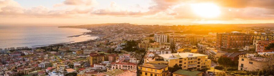 Golden sunset over Naples with the coastline in view