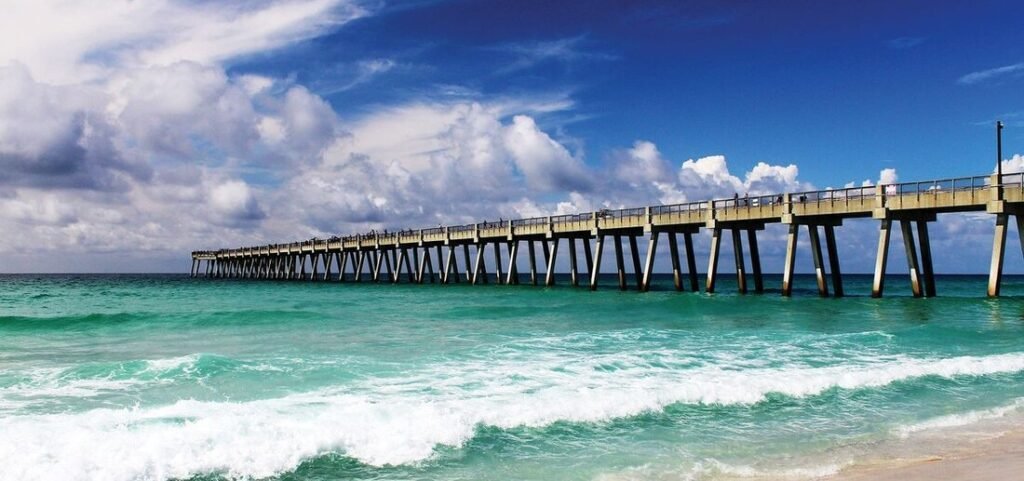 Navarre Beach Pier Florida with turquoise Gulf water, waves, and long fishing pier