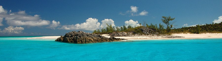 Remote tropical cay surrounded by bright turquoise water in Puerto Rico.