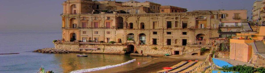Palazzo DonnโAnna and Bagno Elena along the Naples waterfront