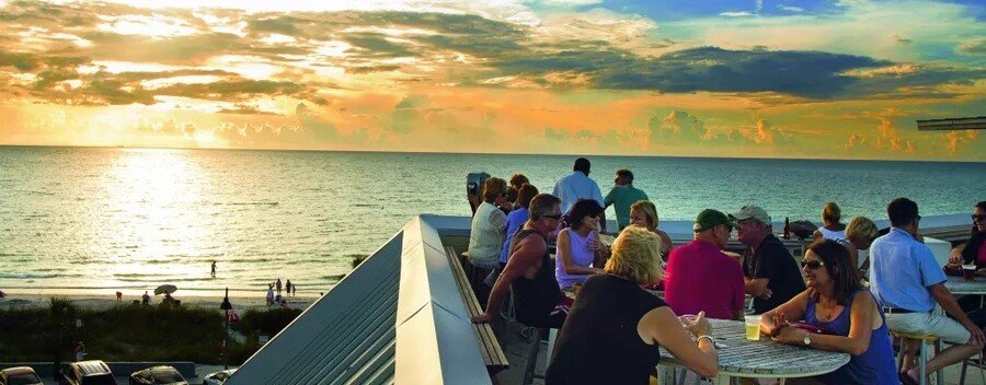 Rooftop sunset dining in Pass-a-Grille Florida overlooking Gulf Coast beach and ocean views