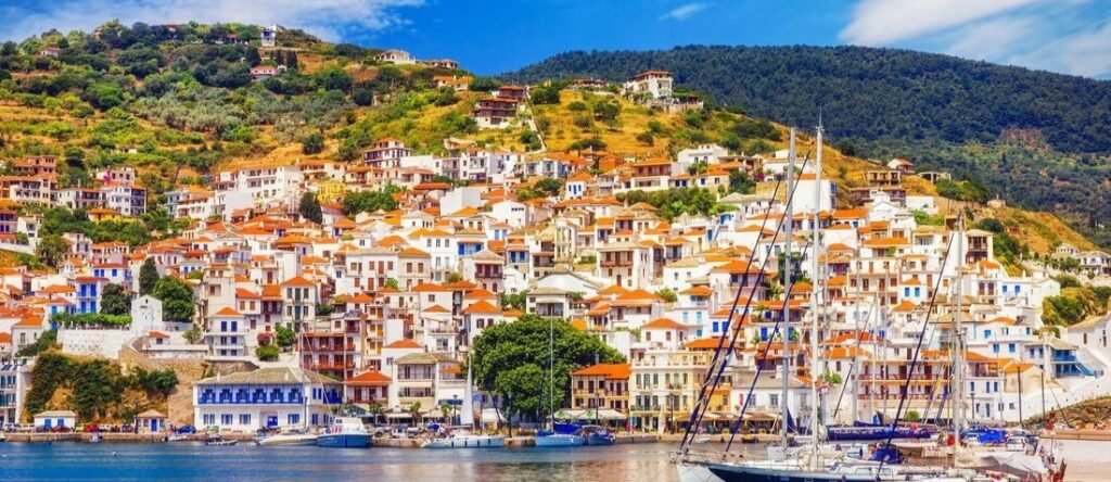skopelos town harbor with colorful houses and boats in skopelos greece