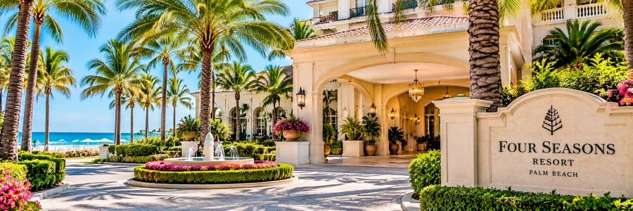 Four Seasons Resort Palm Beach with elegant architecture, palm trees, tropical gardens, and Atlantic Ocean views