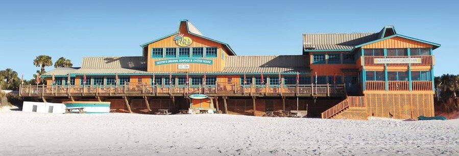 The Back Porch restaurant in Destin Florida located directly on the white sand beach