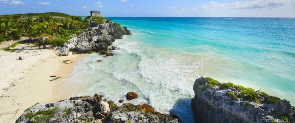 Tulum Beach on the Yucatan Peninsula | Beach Travel Destinations Yucatan Peninsula beaches at Tulum with turquoise Caribbean water, white sand, and ancient Mayan ruins.