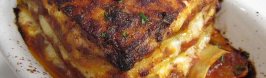 Baked lasagna with melted cheese and marinara sauce at Venetian Hot Plate in Port Aransas Texas.