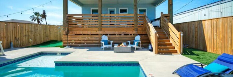 Private vacation rental with swimming pool, deck seating, and outdoor gathering area near the beach in Port Aransas.