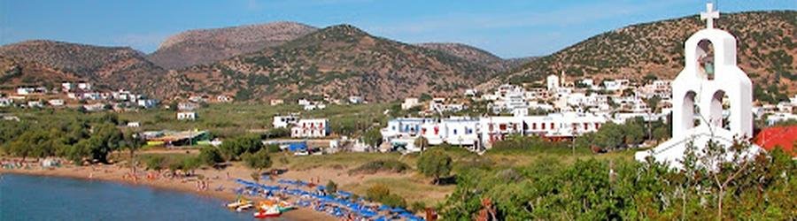Galissas Beach in Syros, Greece, with sandy shore, swimmers, and hillside backdrop.