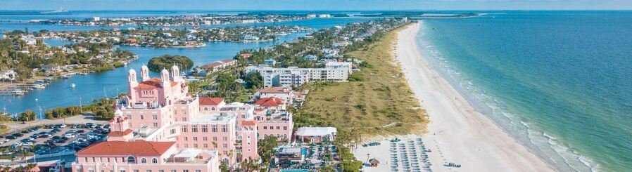 Aerial view of St. Pete Beach Florida with Don CeSar Hotel pink building, white sand shoreline, and Gulf of Mexico