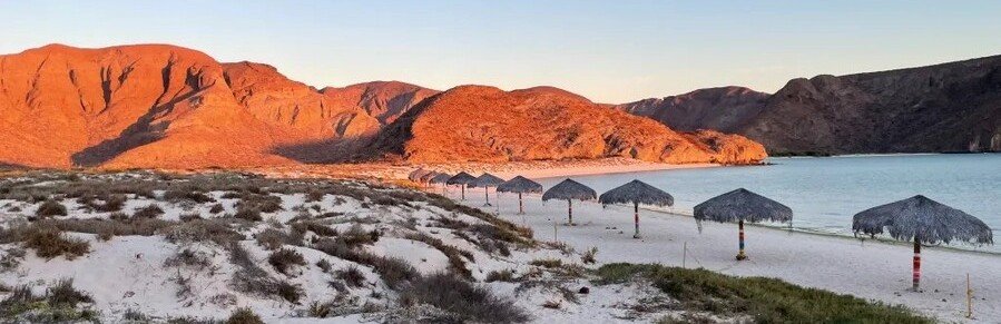 Balandra Beach in La Paz with calm turquoise water and desert mountains along the Mexican Riviera cruise route