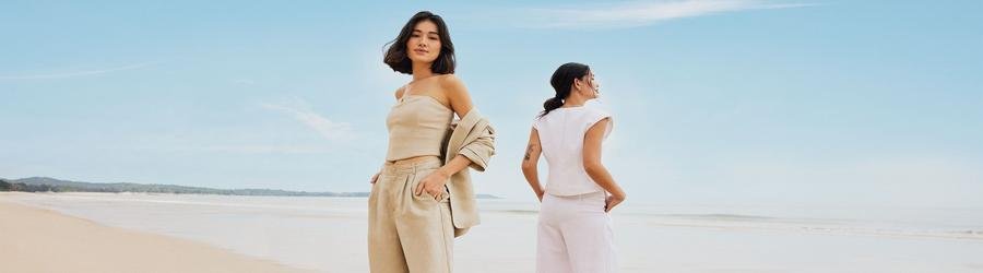 Stylish beach clothes for women, featuring neutral tones perfect for a seaside getaway.