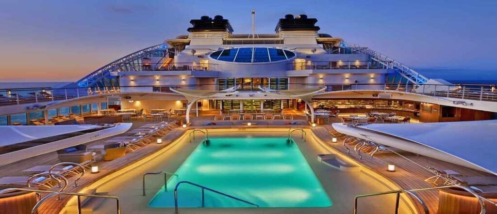 Is a cruise right for me?  Luxury cruise ship pool deck at night with ocean views and illuminated seating