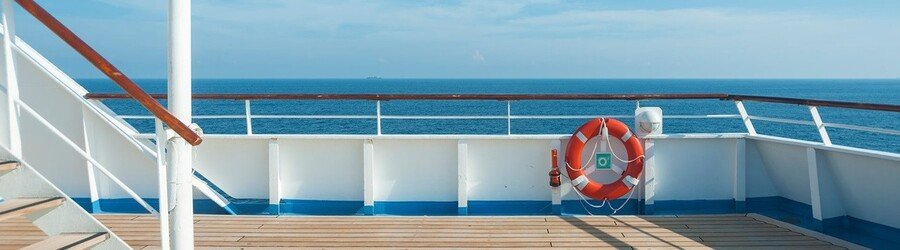 Life ring mounted on a cruise ship deck overlooking the open ocean