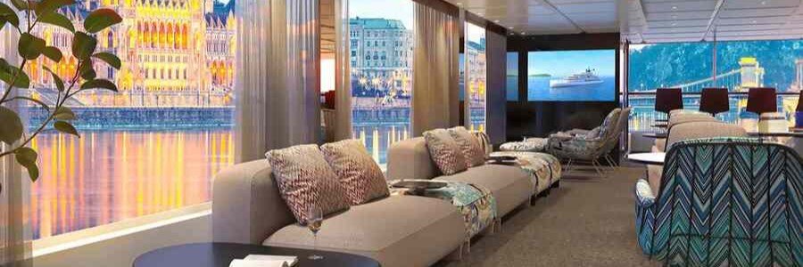Elegant lounge aboard a Grand Danube cruise ship with panoramic river views.
