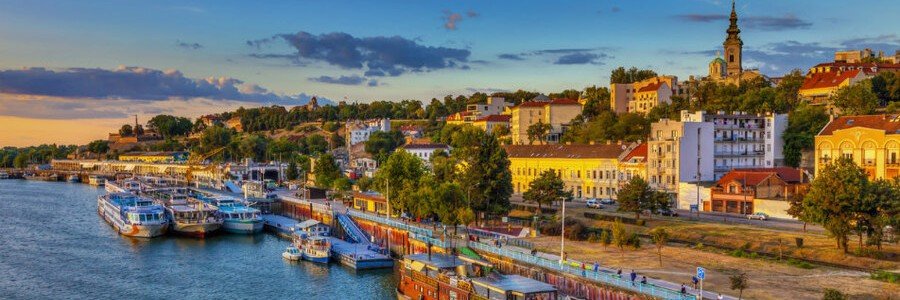 River cruise ships line the waterfront of a charming town along the scenic Lower Danube.