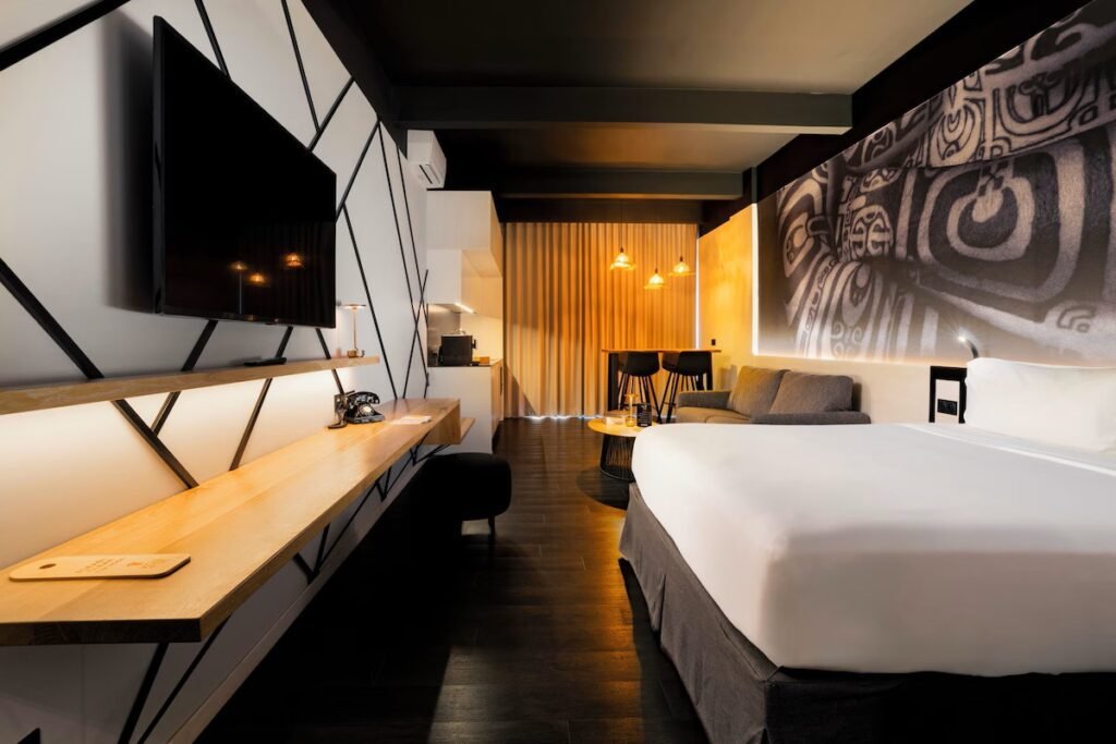 Boutique hotel in Tahiti with rooftop dining, harbor views, and modern guest room