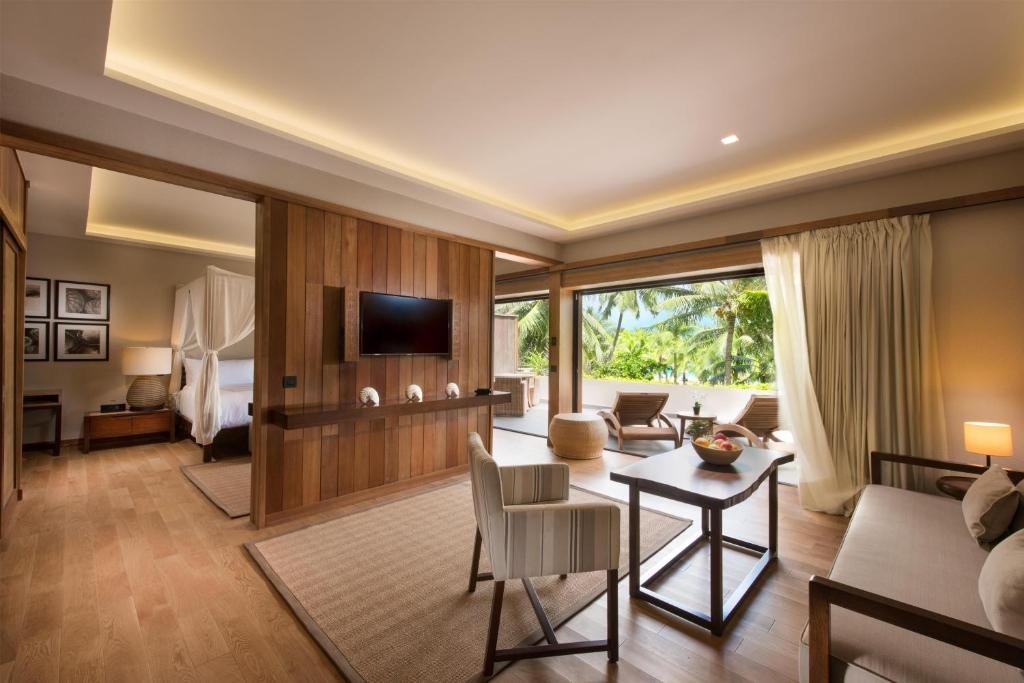 Conrad Bora Bora Nui villa interior, private pool terrace, and sunset lagoon view with overwater bungalows