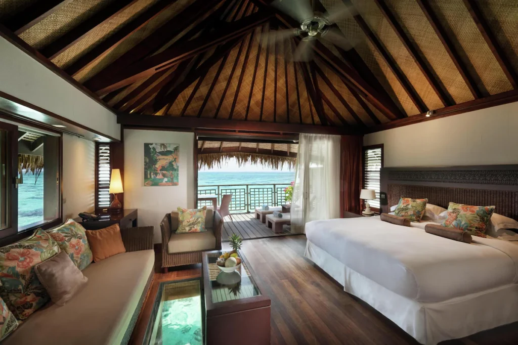 Overwater bungalow and villa interiors at Hilton Moorea Lagoon Resort with lagoon views and tropical design