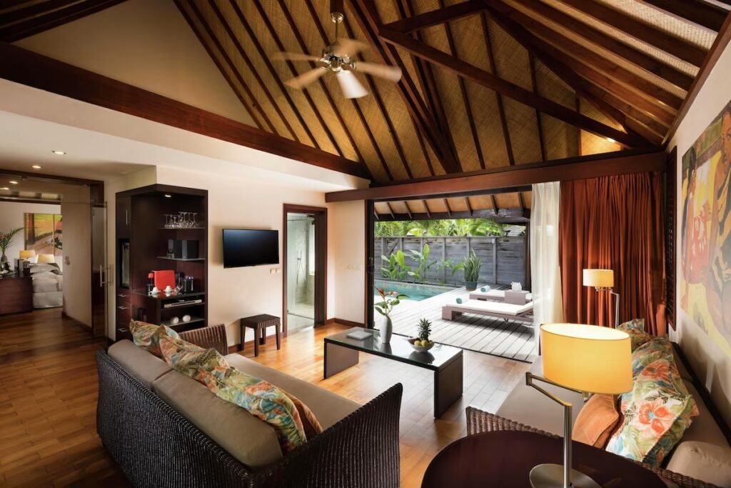 Overwater bungalow and villa interiors at Hilton Moorea Lagoon Resort with lagoon views and tropical design