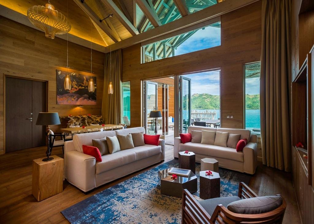 Luxury overwater villa interior and private deck at InterContinental Bora Bora with lagoon views and Mount Otemanu backdrop