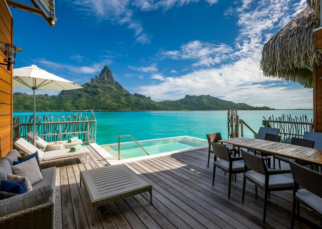 Luxury overwater villa interior and private deck at InterContinental Bora Bora with lagoon views and Mount Otemanu backdrop