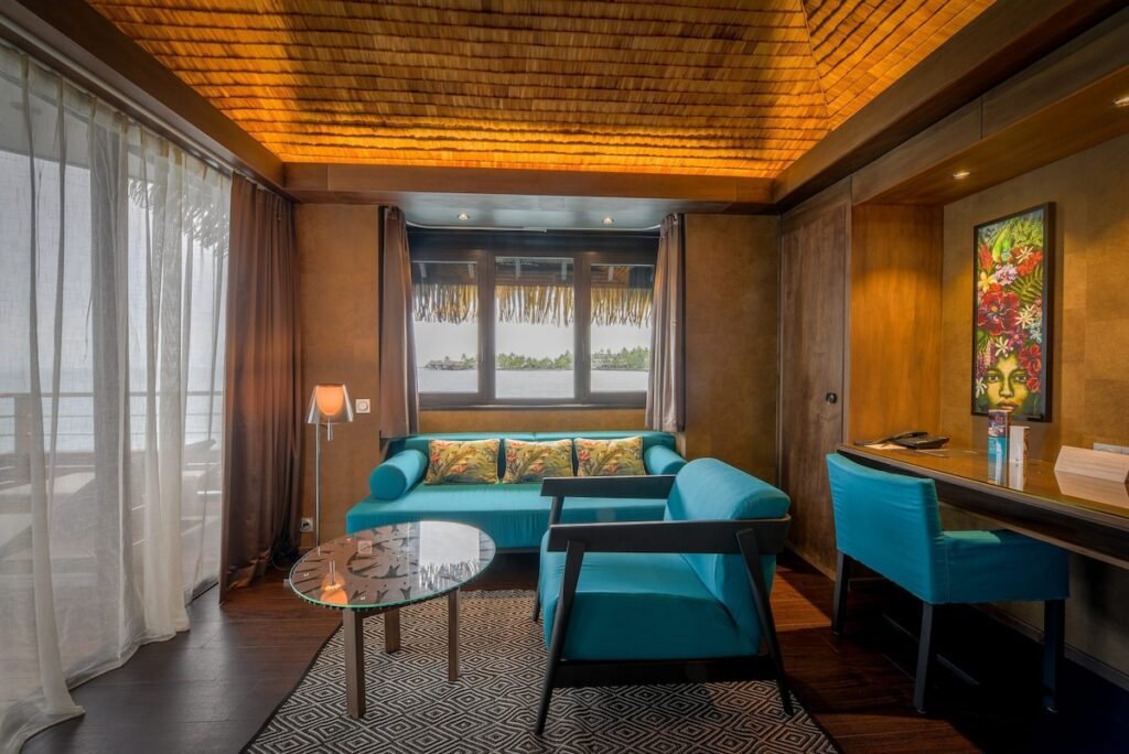 Luxury overwater bungalow and resort rooms in Tahiti with ocean views and tropical design