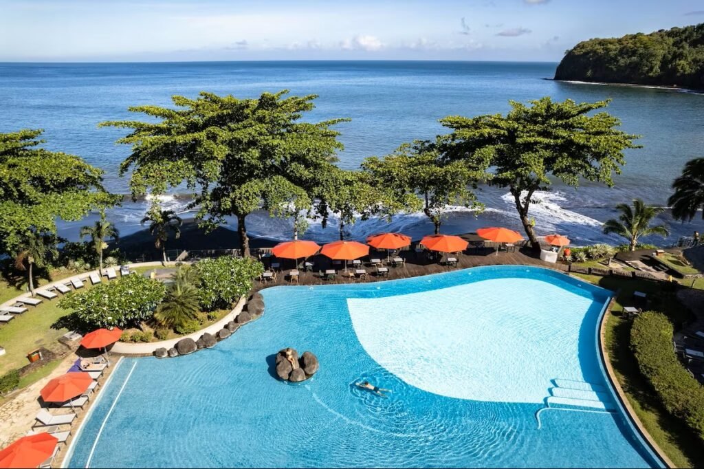 Oceanfront resort rooms and pool at Le Tahiti by Pearl Resorts with coastal views