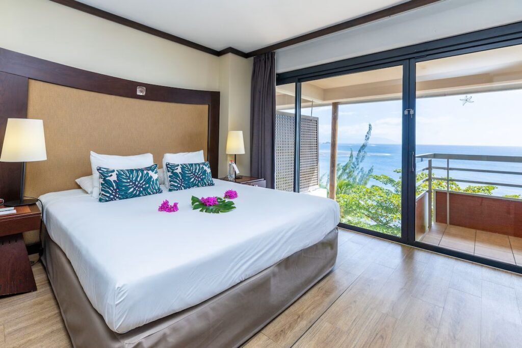Oceanfront resort rooms and pool at Le Tahiti by Pearl Resorts with coastal views