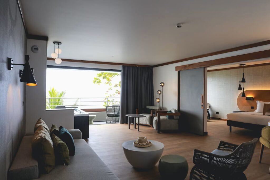 Oceanfront resort rooms and pool at Le Tahiti by Pearl Resorts with coastal views