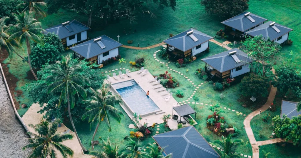 Boutique beachfront retreat in Tahiti with private villas, pool, and tropical surroundings