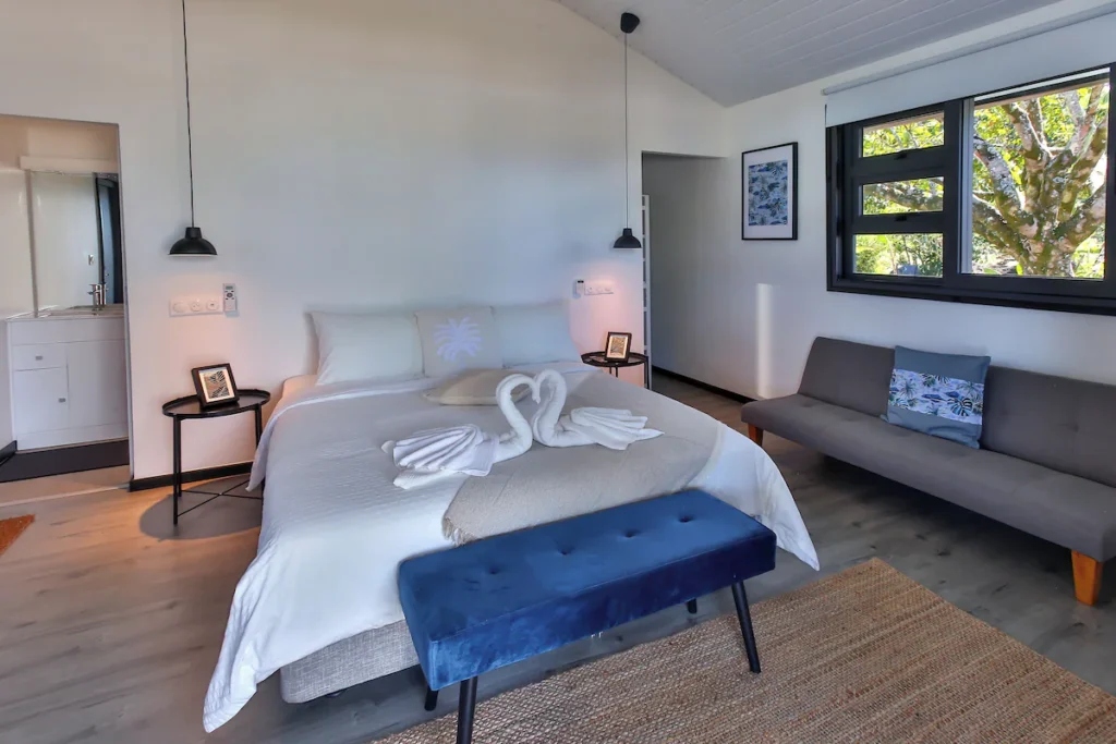 Boutique beachfront retreat in Tahiti with private villas, pool, and tropical surroundings