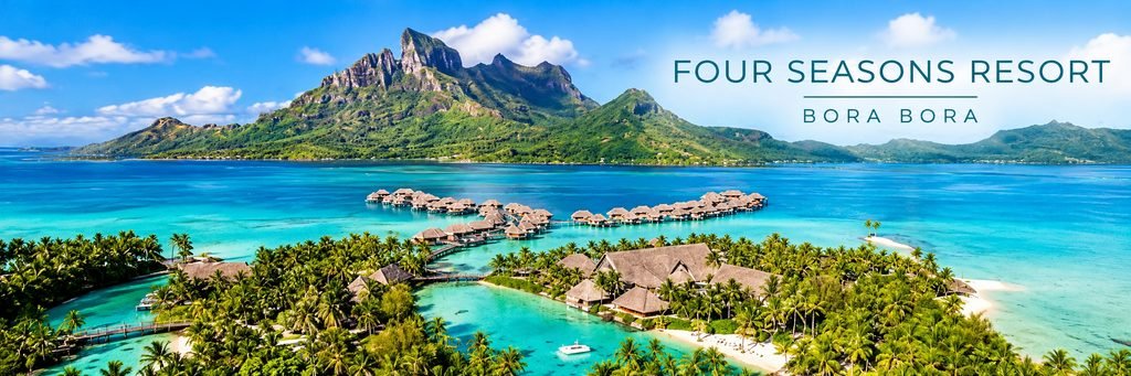 Aerial view of Four Seasons Resort Bora Bora featuring luxury overwater bungalows, turquoise lagoon waters, tropical gardens, and Mount Otemanu.